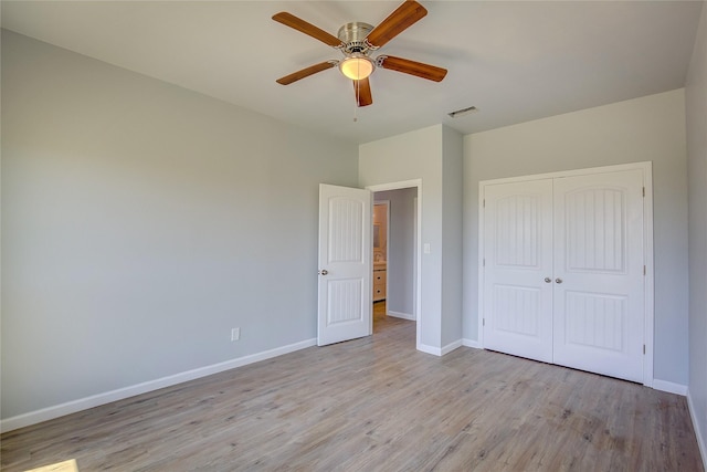 4340 Fm 1563, Wolfe City, TX 75496 - unfurnished bedroom with baseboards, light wood-style floors, ceiling fan, visible vents, and a closet