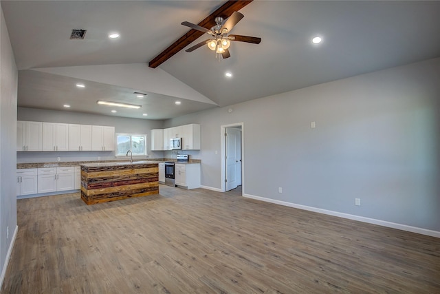 4340 Fm 1563, Wolfe City, TX 75496 - kitchen featuring a sink, wood finished floors, open floor plan, stainless steel appliances, and visible vents
