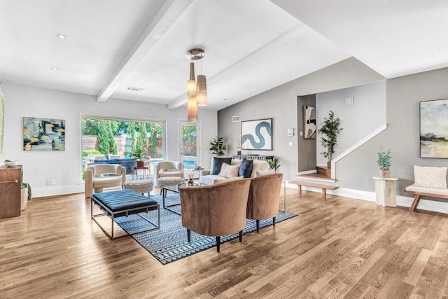 living room with wood-type flooring and lofted ceiling with beams