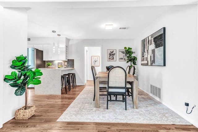 dining area featuring light hardwood / wood-style flooring