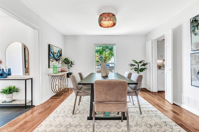 dining room with light wood-type flooring