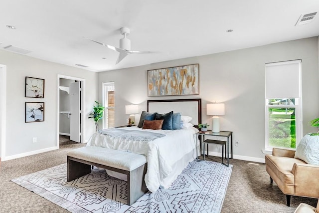 bedroom featuring ceiling fan and carpet