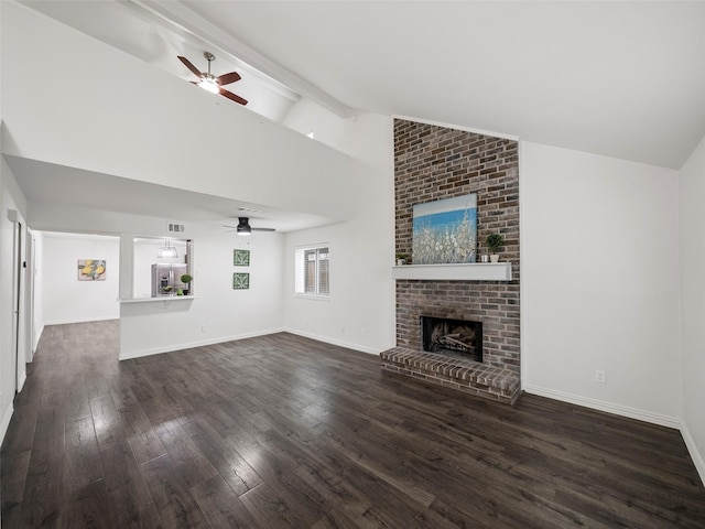 unfurnished living room featuring vaulted ceiling with beams, a fireplace, baseboards, and dark wood finished floors