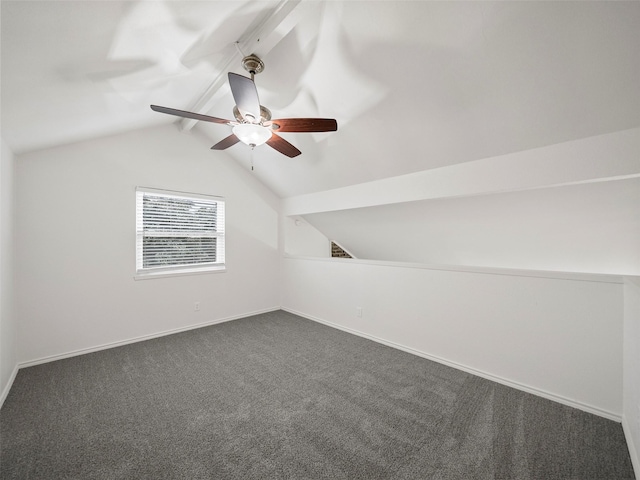 bonus room with vaulted ceiling with beams, dark carpet, and baseboards