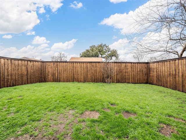 view of yard featuring a fenced backyard