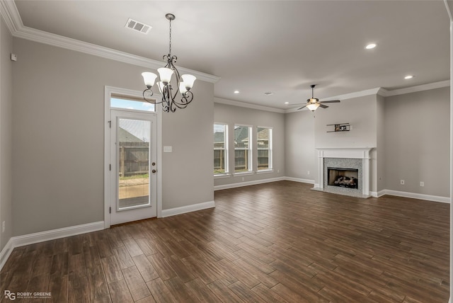 unfurnished living room featuring ornamental molding, dark hardwood / wood-style floors, and ceiling fan with notable chandelier