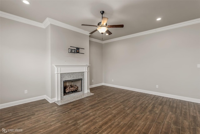 unfurnished living room featuring ornamental molding, dark hardwood / wood-style floors, and ceiling fan