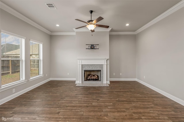 unfurnished living room featuring crown molding, ceiling fan, and dark hardwood / wood-style flooring