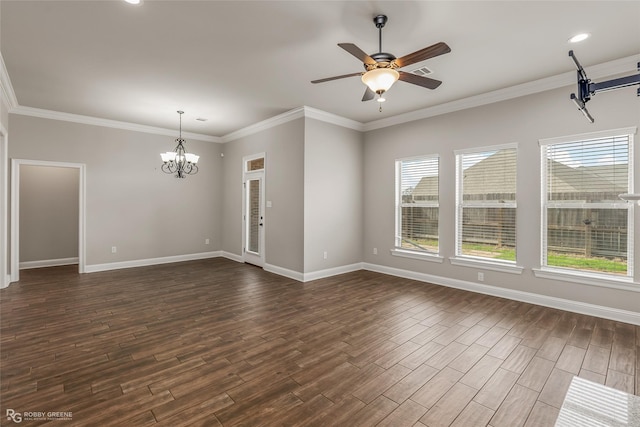 empty room featuring dark wood-type flooring, ornamental molding, and a wealth of natural light