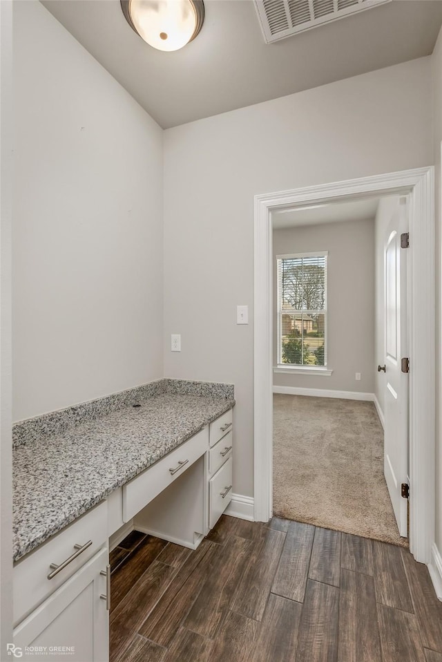 interior space featuring dark wood-type flooring