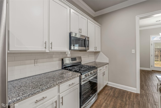 kitchen featuring crown molding, stainless steel appliances, dark hardwood / wood-style floors, light stone counters, and white cabinets