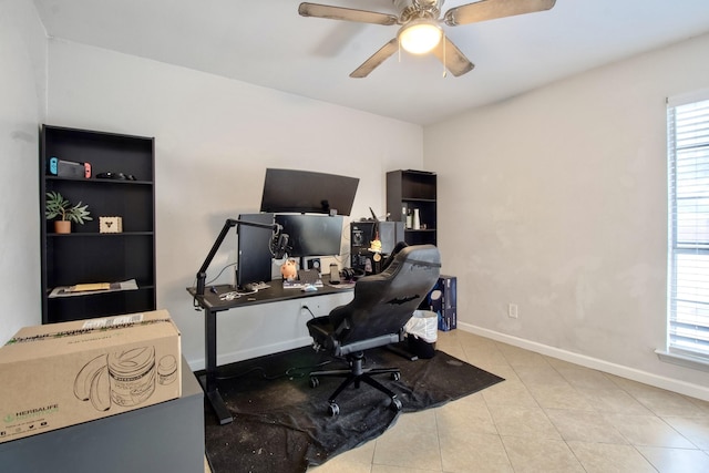 office featuring light tile patterned flooring, ceiling fan, and baseboards