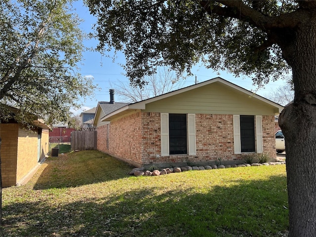 view of property exterior with cooling unit and a lawn