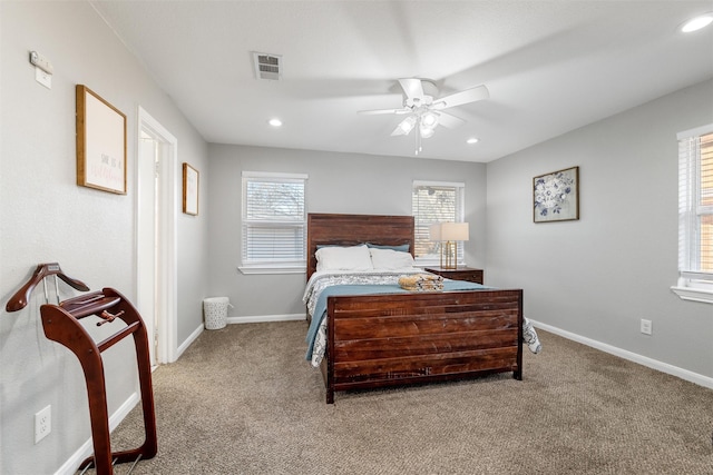 bedroom featuring ceiling fan and light carpet