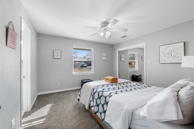 carpeted bedroom with ceiling fan