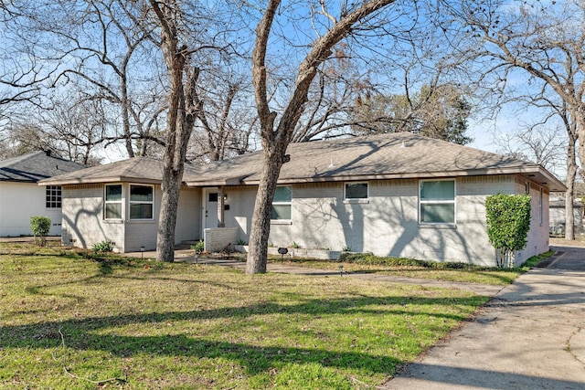 ranch-style home with a front lawn