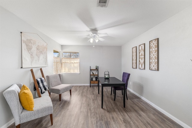 office with hardwood / wood-style flooring, a textured ceiling, and ceiling fan