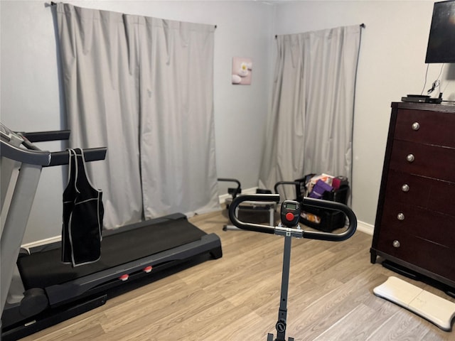 workout room with light wood-type flooring