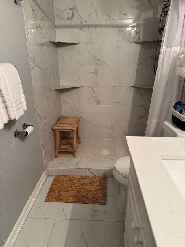 bathroom featuring vanity, curtained shower, and toilet