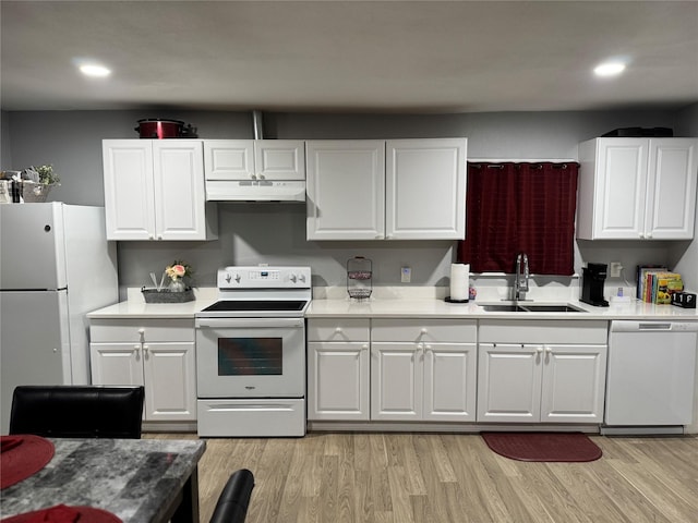 kitchen featuring white cabinetry, white appliances, sink, and light hardwood / wood-style flooring