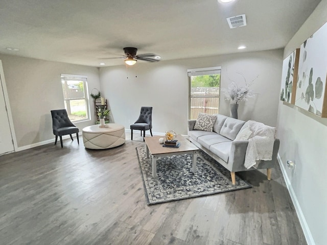 living room featuring hardwood / wood-style flooring and ceiling fan