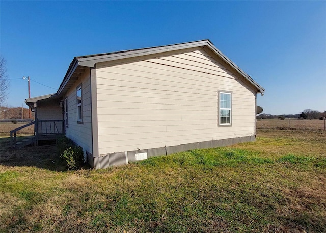 view of home's exterior featuring a lawn