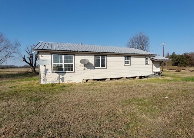 back of house with a yard