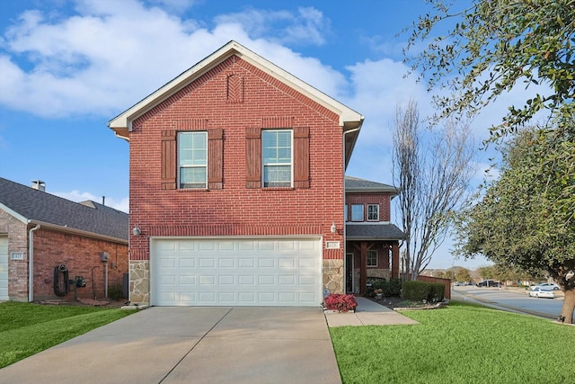 view of front property featuring a garage and a front lawn