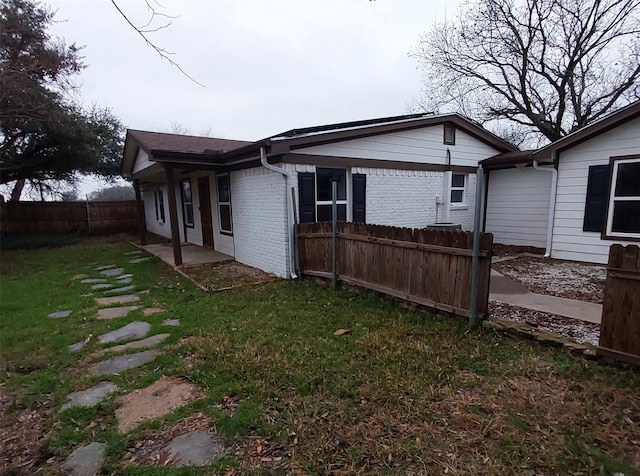 view of home's exterior featuring a yard