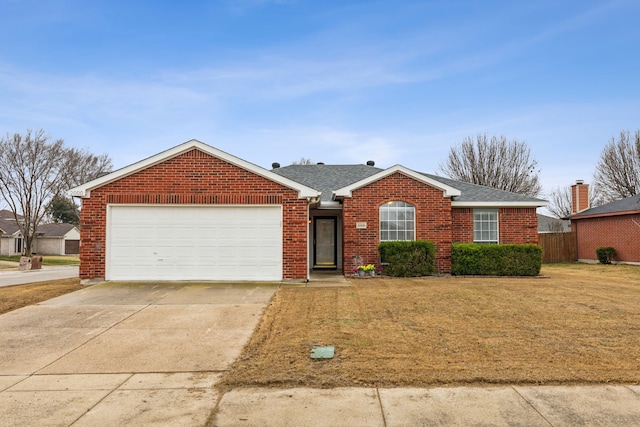 ranch-style house featuring a garage and a front lawn