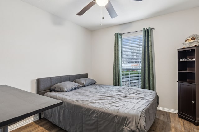 bedroom with hardwood / wood-style flooring and ceiling fan