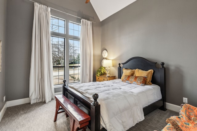 carpeted bedroom featuring high vaulted ceiling