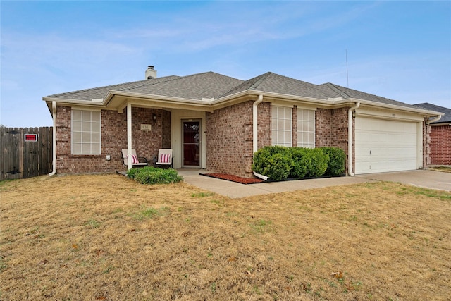 ranch-style house with brick siding, an attached garage, a front yard, fence, and driveway