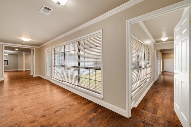 corridor featuring ornamental molding and dark hardwood / wood-style floors