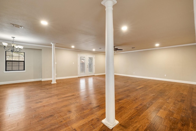 basement with crown molding, hardwood / wood-style floors, ceiling fan, and french doors