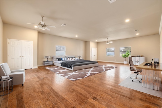 bedroom featuring ceiling fan and light hardwood / wood-style floors