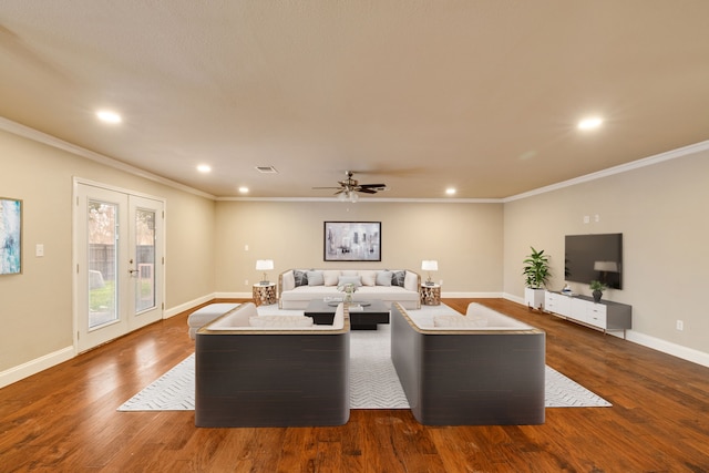 living room featuring wood-type flooring, ornamental molding, ceiling fan, and french doors