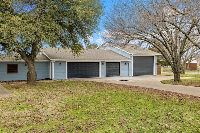 ranch-style home with a garage and a front yard