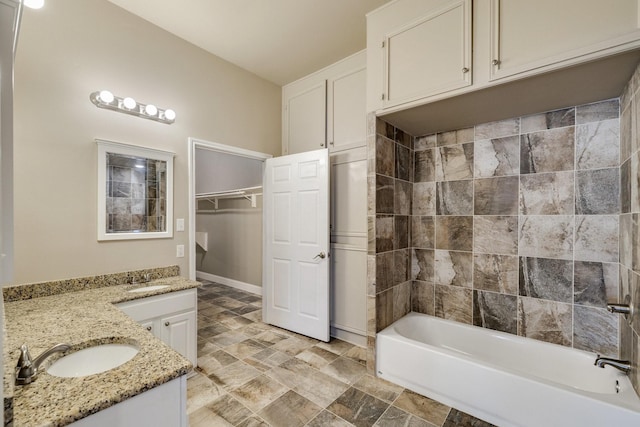 bathroom with vanity and shower / washtub combination