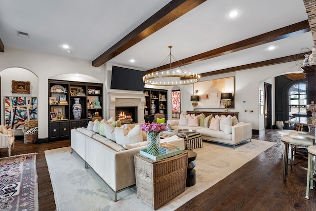 living room with beam ceiling and wood-type flooring