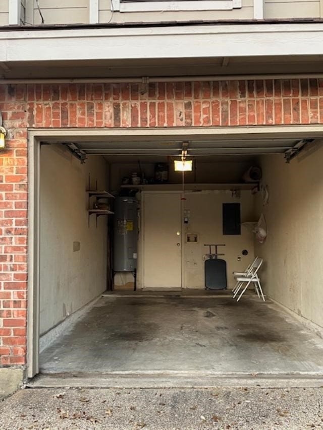 garage with electric panel and water heater