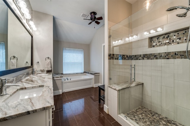 bathroom with vanity, vaulted ceiling, ceiling fan, separate shower and tub, and tile patterned flooring