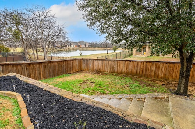 view of yard with a water view