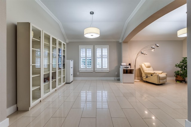 tiled foyer entrance featuring crown molding and vaulted ceiling