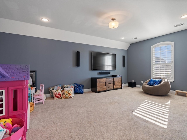 rec room with vaulted ceiling and carpet floors