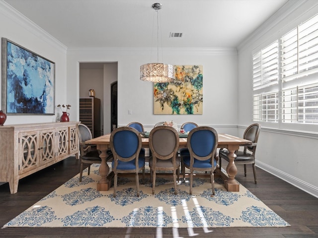 dining space with crown molding and dark hardwood / wood-style flooring