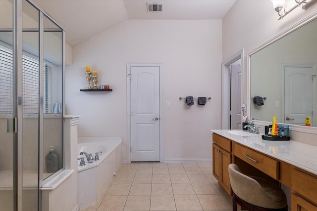 bathroom with lofted ceiling, vanity, tile patterned floors, and independent shower and bath