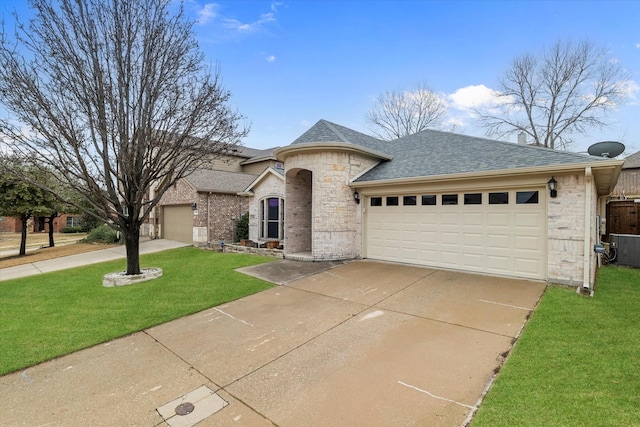 view of front of property featuring a garage and a front lawn