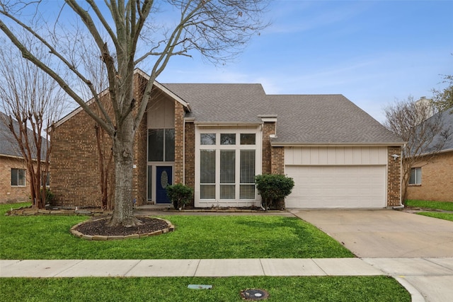 view of front of home with a garage and a front yard