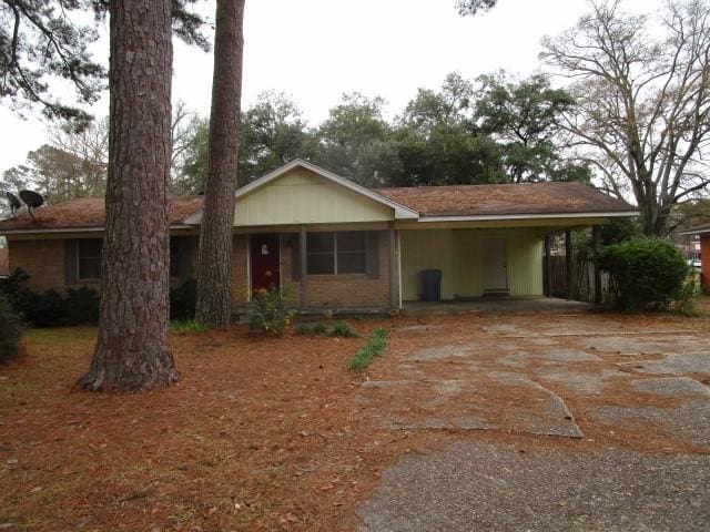 ranch-style house with a carport